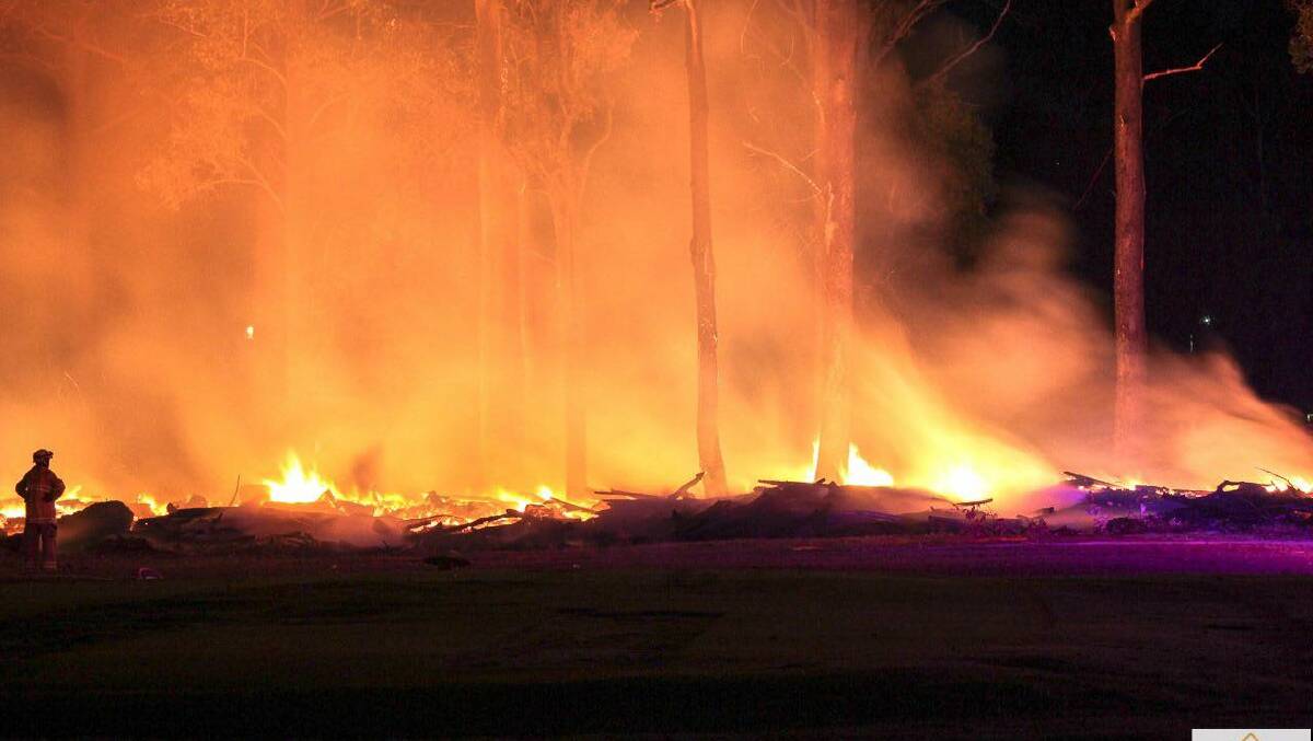 The burning pile of waste took more than four hours to control. Photo: Kenny Holland.