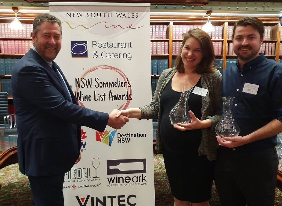 NSWWIA President Mark Bourne (left) congratulating winners Jennifer Paquet and Pete Cutcliffe from Bills Fish House, in the beautiful Jubilee Room at NSW Parliament House, Sydney.