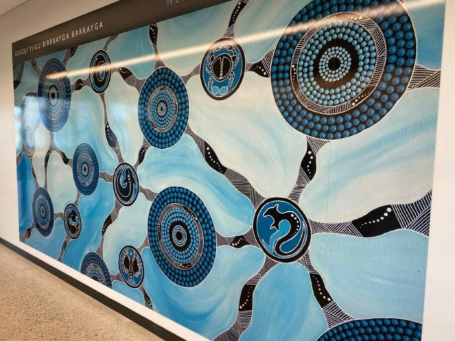 Cultural welcome: Welcome to Birpai Country - the greeting every passenger will see when they arrive at Port Macquarie airport. The artwork commissioned by council is by Birrbay artist Angela Marr-Grogan.