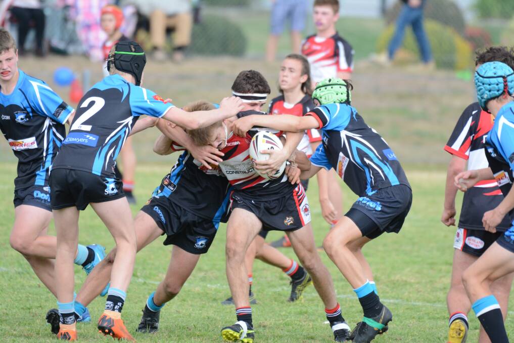 Port Sharks defenders stop a Taree Red Rovers player during last season's under 13 grand final. 