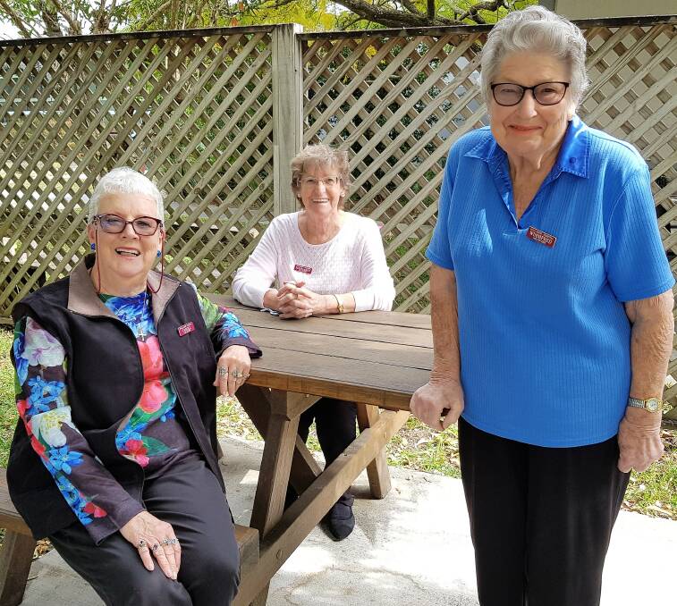 Wauchope Hospital Volunteers President Win Secombe (standing) with Secretary Carole Peters (front) and Margaret Mostyn.