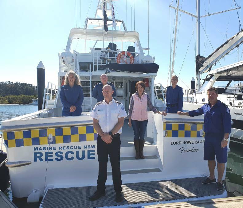 Marine Rescue NSW fleet manager Kelvin Parkin, Marine Rescue NSW Lord Howe Island unit commander Jim McFadyen, (back) Marine Rescue NSW Port Macquarie's Alison Cameron-Brown and Greg Davies, Port Macquarie MP Leslie Williams and Marine Rescue NSW Port Macquarie's Yolanda Bosschieter inspect the boat bound for Lord Howe Island.