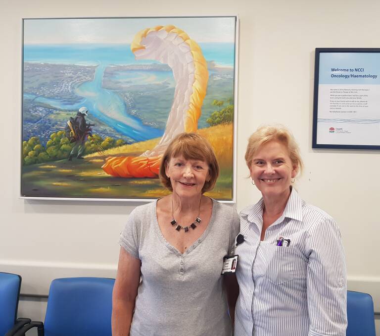 Artist Jan Wilson and Nursing Unit Manager Jenny Baroutis with the painting commissioned by the Mid North Coast Machinery Restoration Club.

 