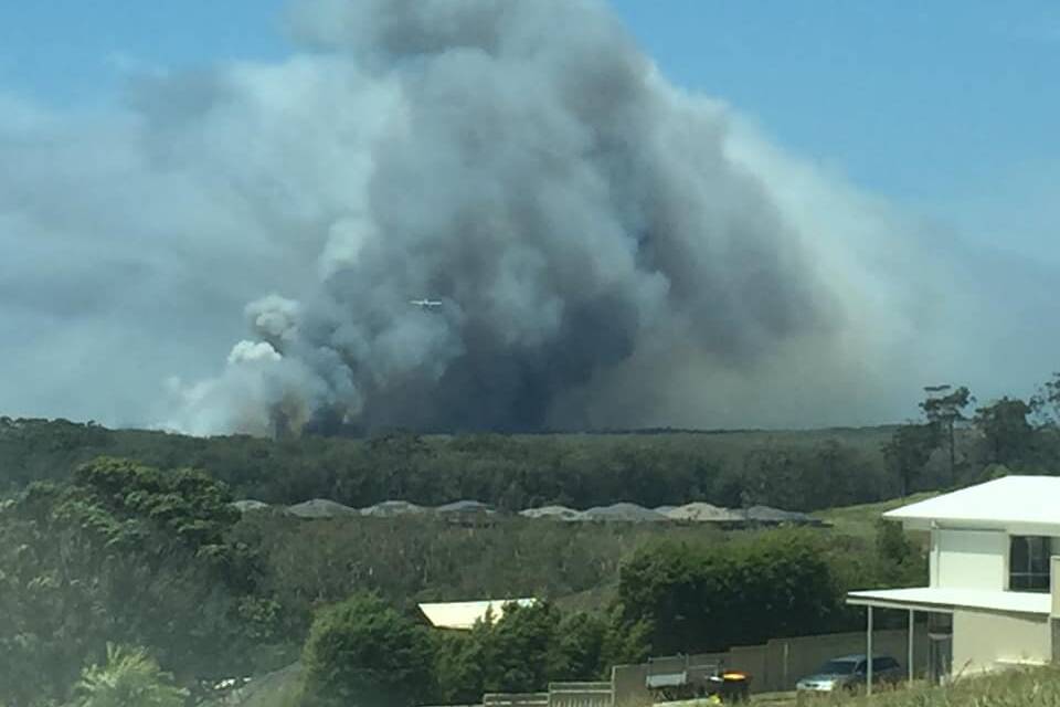 The Elkhorn Trail fire south of Port Macquarie. The seaplane is now waterbombing the area. Photo: Hayley Soady.