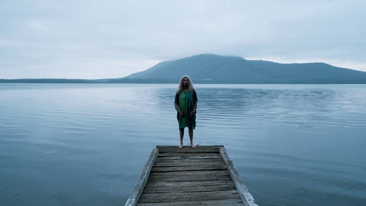 As one: Aunty Rhonda Radley connecting with place at Queen's Lake, Birpai land on which we all walk and share. Photo: Silver Quinn Productions.