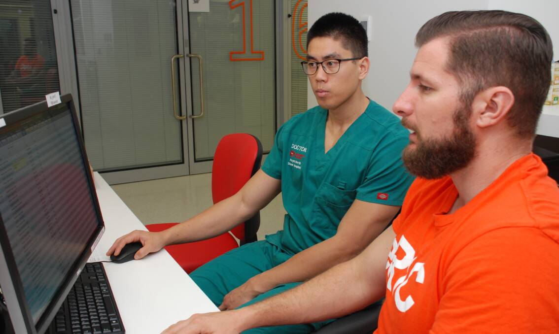 Port Macquarie Base Hospital Junior Medical Officer Dr Chu Nguyen (left) with Acting Clinical Nurse Educator Matthew Cox at the hospital’s Intensive Care Unit.