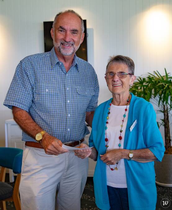 Donation: Mark Youngblutt, President of Lions with Anne Gaffney, President of the Westport Travel Club.