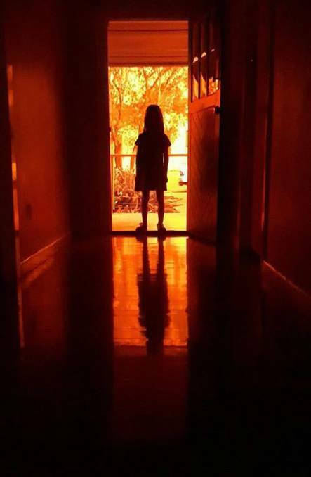 This evocative photo by Robert Dixon of his nine-year-old daughter the day the sky turned orange over the Hastings made international headlines.