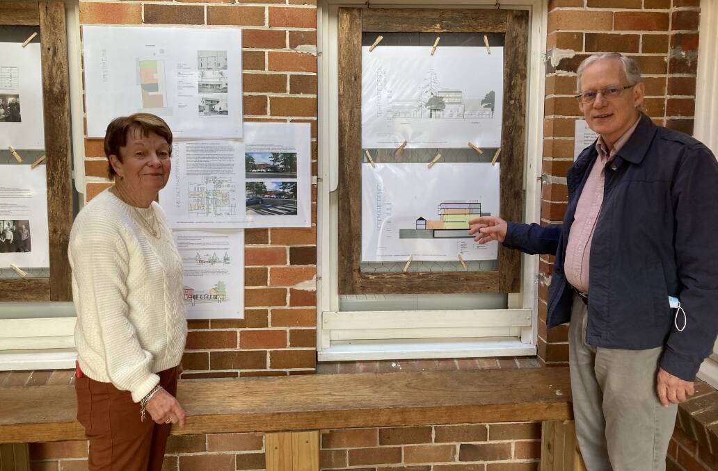 Port Macquarie Historical Society president, Clive Smith talks to Museum volunteer Sandra McAlpin about the schematic design for the Port Macquarie Museum's transformation.