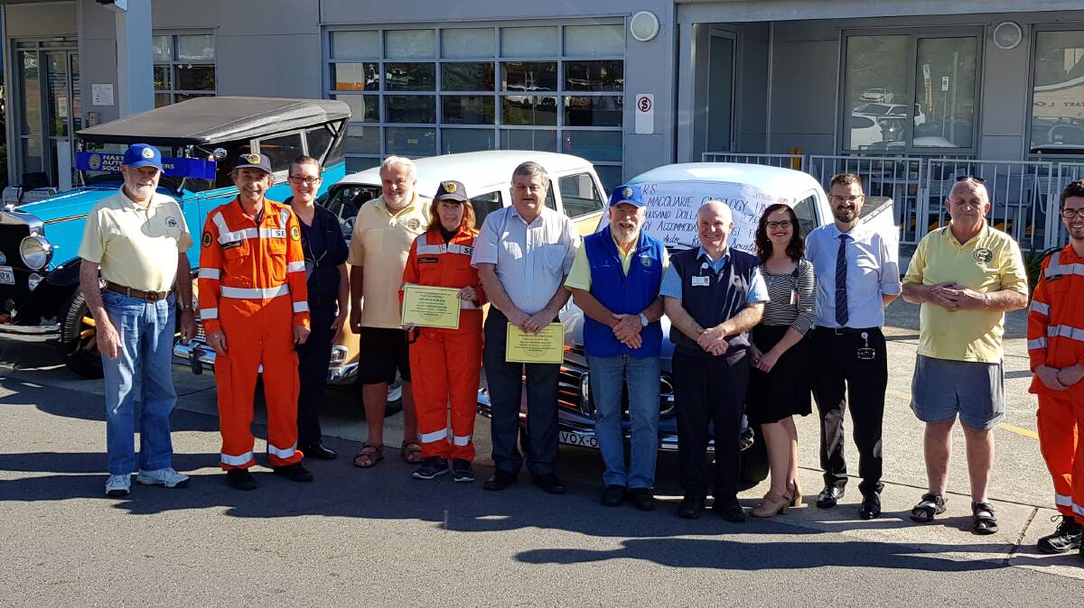 HARS member Len Colbert, SESs Phil Johnson, Acting Nurse Unit Manager Katie Gooch, HARS member Peter Denham, SESs Rosie Johnson, Port Macquarie Race Club CE Michael Bowman, HARS President Chris Whalley, Cancer Care Coordinator Ken Procter, MNCCI Office Manager Mary Spackman, Radiation Oncologist Dr Jacques Hill, HARS Ron Rocket Turnbull and SES volunteer Jared Bradley at the MNCCI for their annual donation presentation.