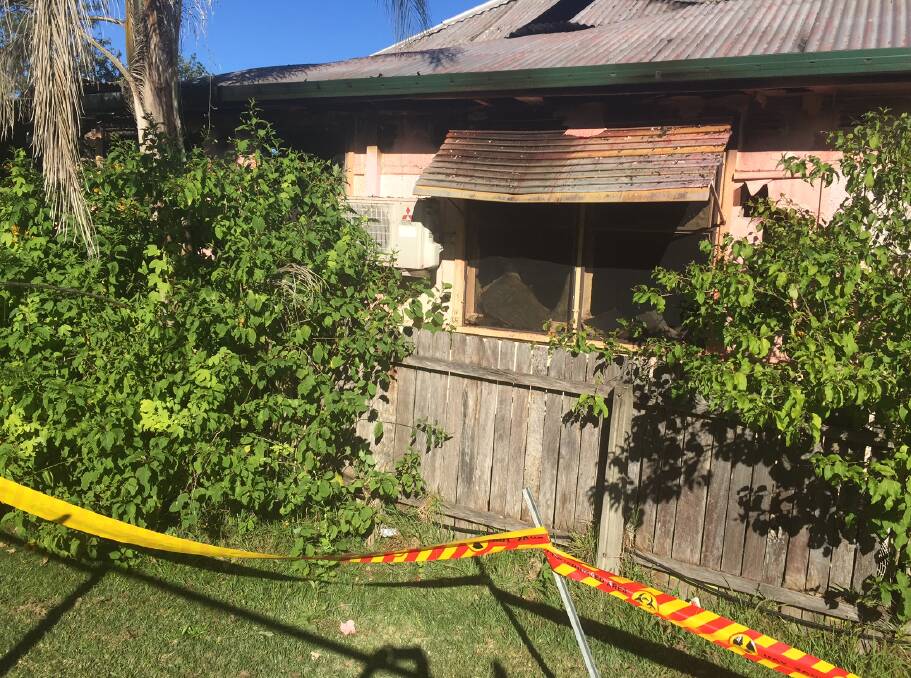 A fire ripped through a cottage located behind the old fire station headquarters in Port Macquarie.