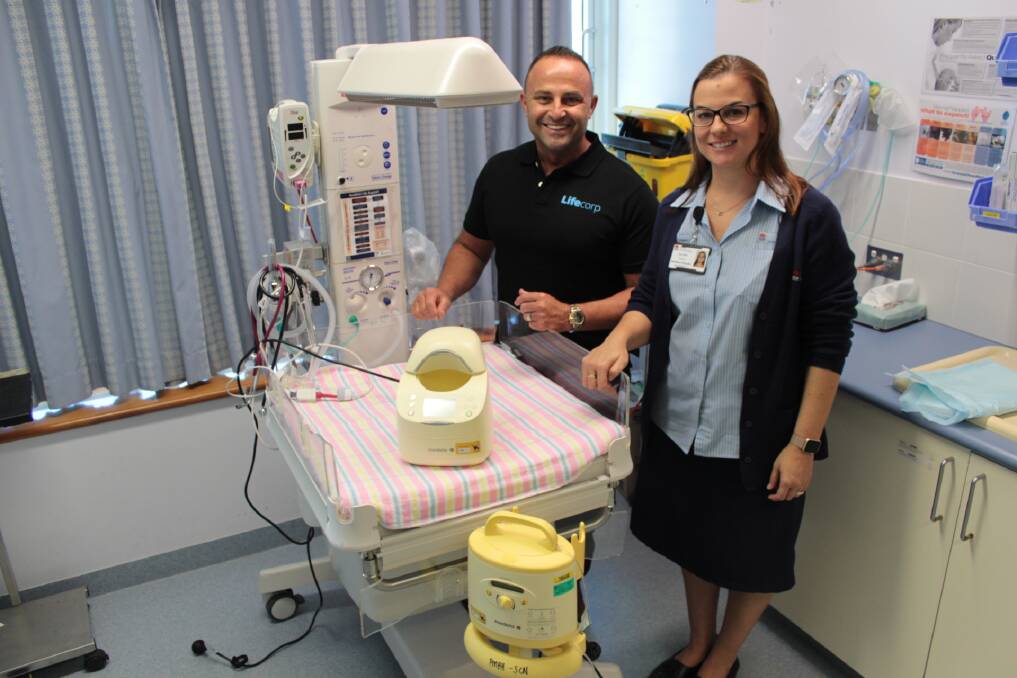Donation: Phil Anderson, Lifecorp founder, donates special equipment to Olivia Tierney of Port Macquarie Base Hospital's maternity unit.