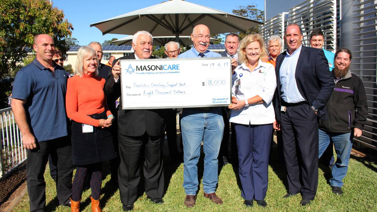Gift: Freemasons Alan Williams and Robert Drysdale (centre) were delighted to hand over a cheque to the Mid North Coast Cancer Institute.