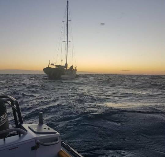 The yacht off South West Rocks was safely towed back to calmer waters with a lone sailor and his dog on board. Photo: Marine Rescue NSW.