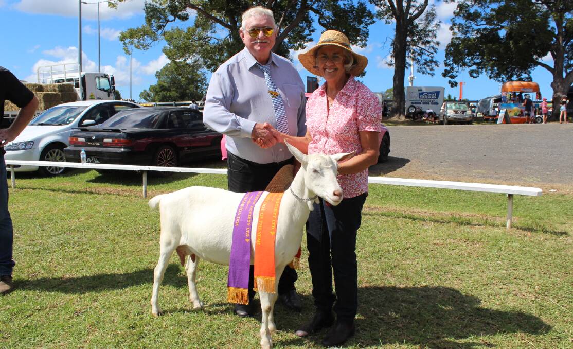 Goat judge Michael Hately with Nea Hosking winner of grand champion dairy doe of the year.