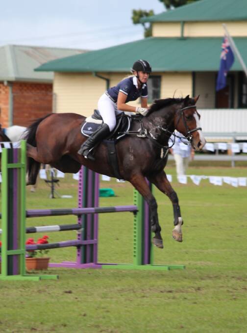 Brooke Atkins in the showjumping arena.