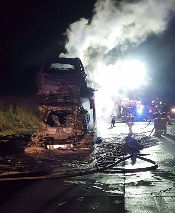 The truck carrying new motor vehciles on fire. Photo: Sancrox Thrumster Rural Fire Service.