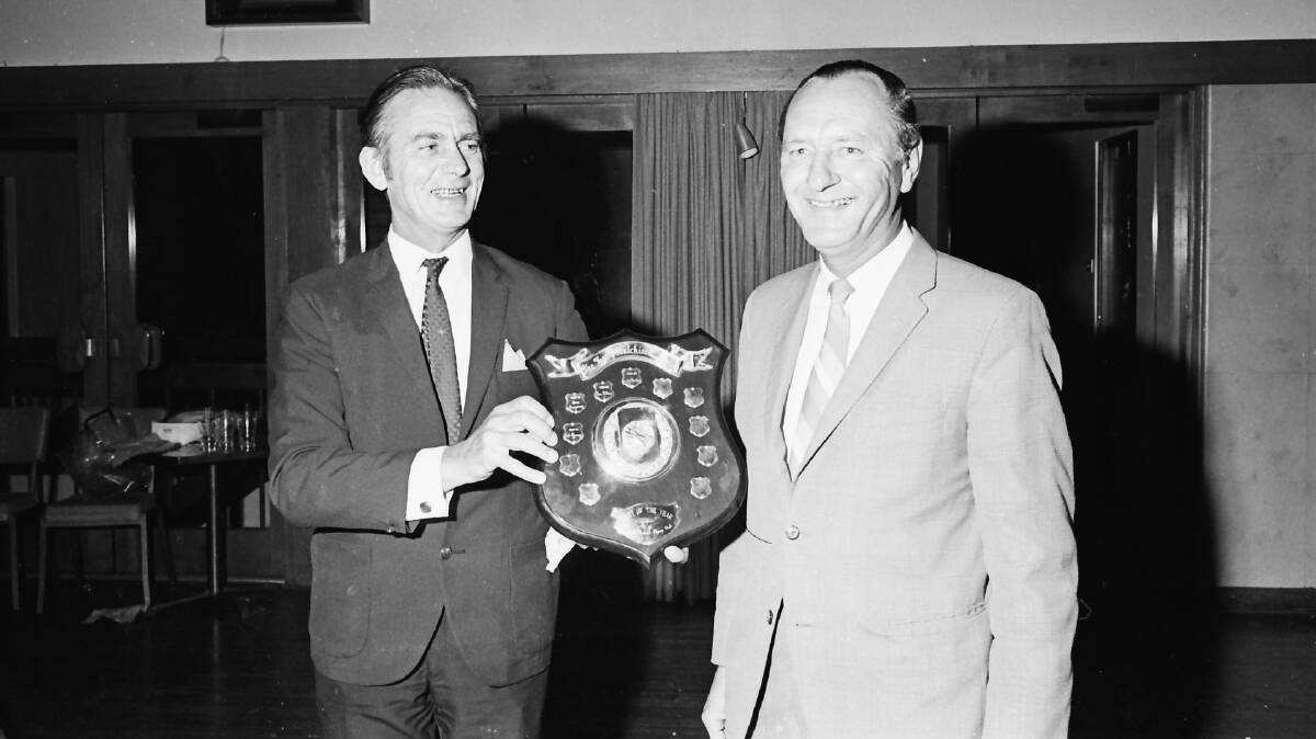 Harry Hutchinson (left) presents the Flying Clubs Pilot of the Year shield to Colin Harvey, 1971