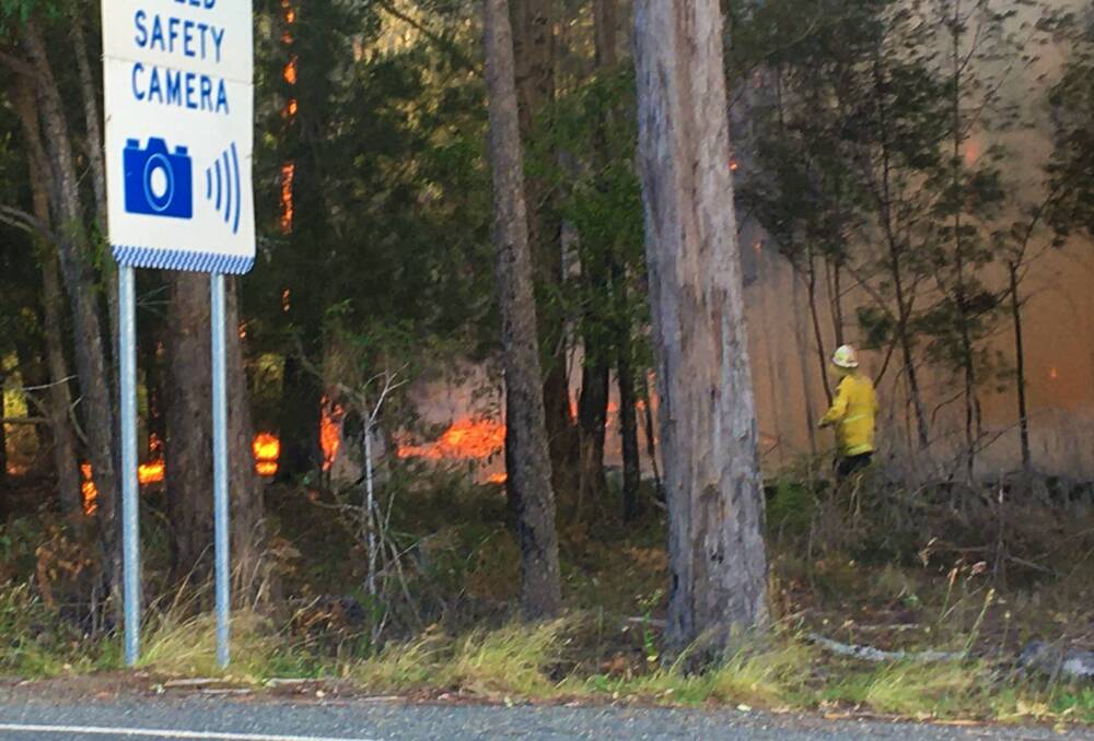 Crews on the ground at Telegraph Point Rd on Sunday.