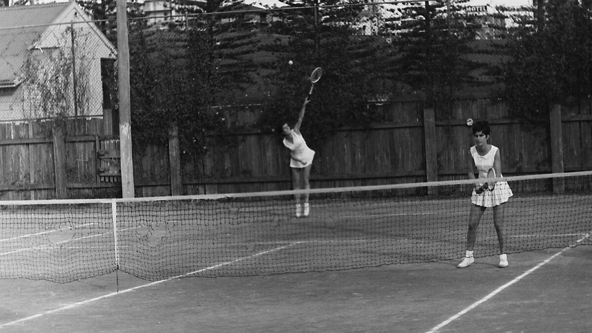 Number 1 seed at the Queens Birthday weekend tennis tournament Helen Kayser serving in the doubles, 1969.