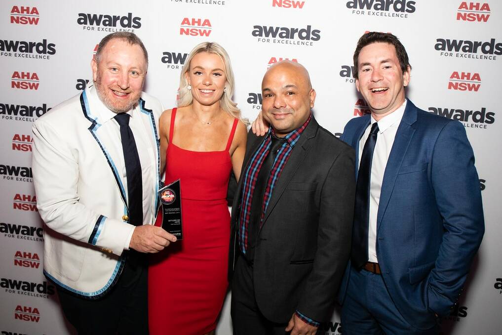 Winners are grinners: Settlers Inn Hotel's Alistair Flower (left) at the 2019 AHA NSW Awards for Excellence.