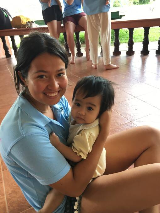 Angela Blackie makes friends at the Agape Home for HIV Orphans in Chiang Mai, Thailand.