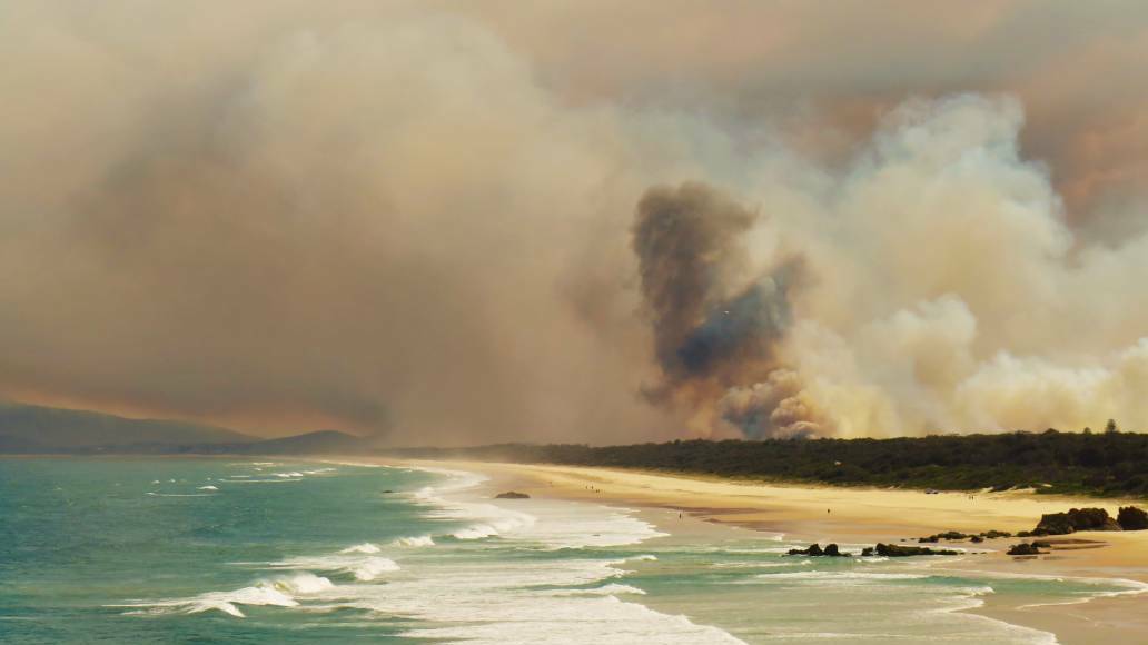 Flames and smoke billow over the beaches south of Port Macquarie.