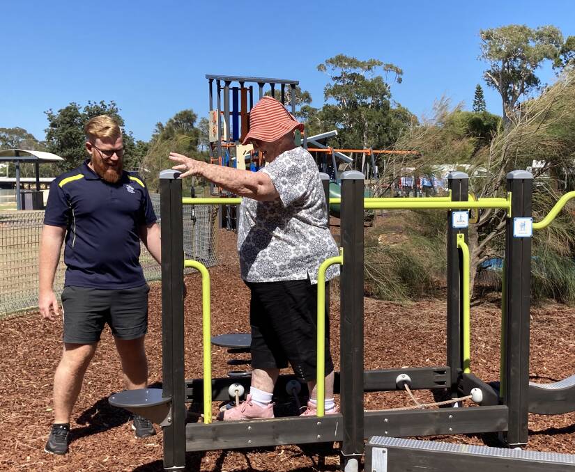 Lake Cathie Medical Centre exercise physiologist Jack Hazelgrove works with local resident Kay Christopherson to demonstrate the benefits of the new Lake Cathie intergenerational gym. 