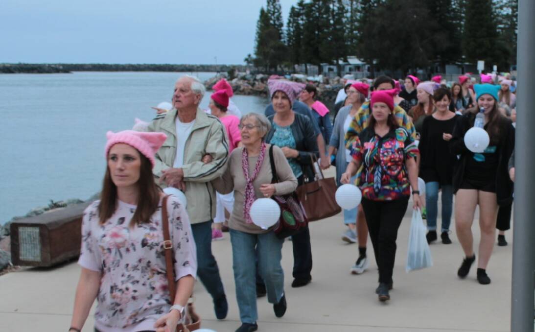 Walkers Reclaim the Night along the Town Green foreshore in Port Macquarie.