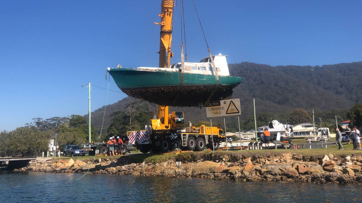 NSW Maritime removes this boat from the river at Laurieton.