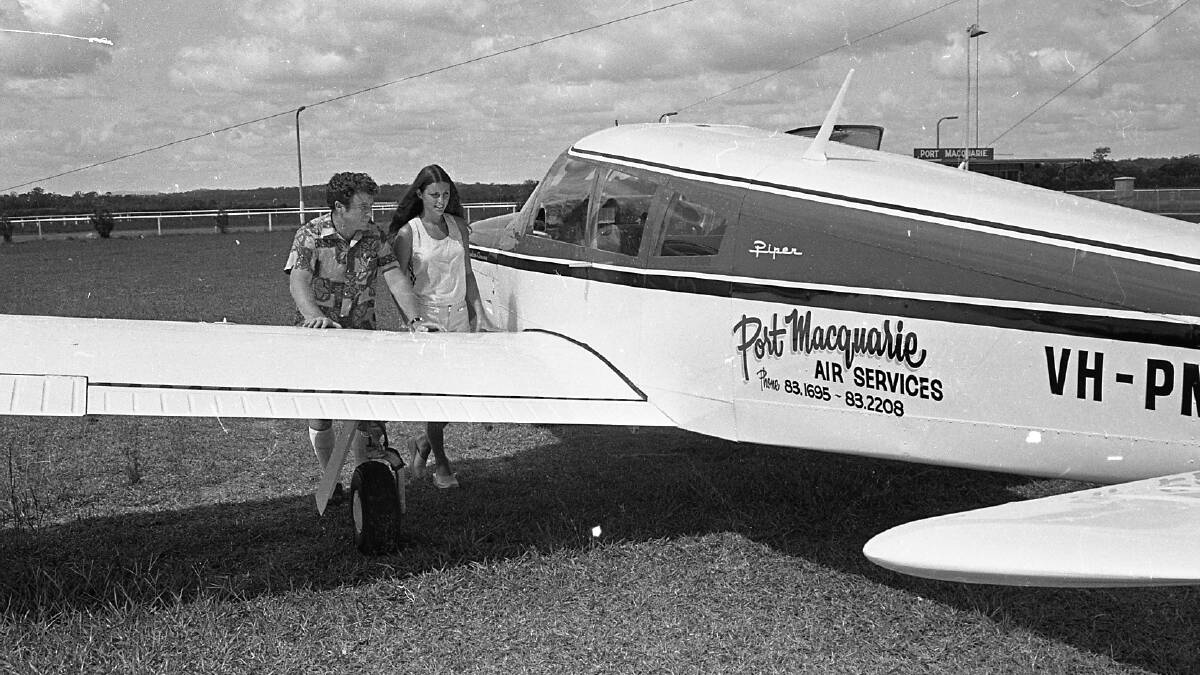 Chief flying instructor, Barrie Abbott with aviation enthusiast, Cherie Robinson, a visitor from New Zealand, 1972