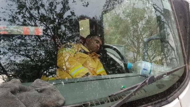 Sancrox-Thrumster RFS captain Aaron Hall catches a nap in the fire truck.