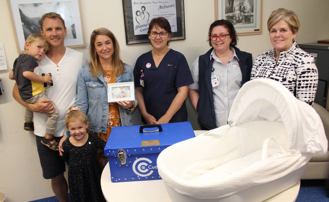 Donation: Brett and Sarah Healey with two-year-old Flynn and five-year-old Emilia with midwife Julie Vegter, Midwifery Unit Manager Celia Collins and Deputy Director of Nursing and Midwifery (Surgery, Womens and Childrens Services) Orinda Jones and the cuddle cot.