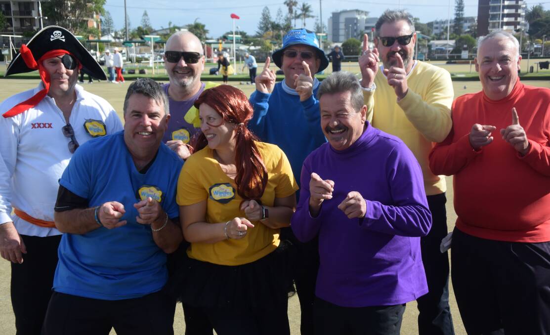 Getting a wiggle on: Claudia Buckbey, Phil Baker, Russell Stockholm, Glen Stewart, Mark Strachan, Paul Troy, Gary Searle and Brad Moore at Give Me 5 For Kids bowls day at Port City Bowling Club.