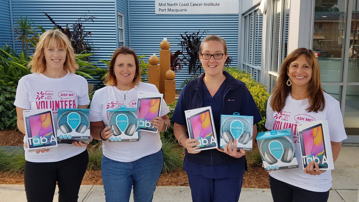 Mothers Day Classic organisers Kylie Bulmer (left) and Carmen Abi-Saab (right) and Pink Girl Tracy Stone present the donation to Nursing Unit Manager Katie Gooch.