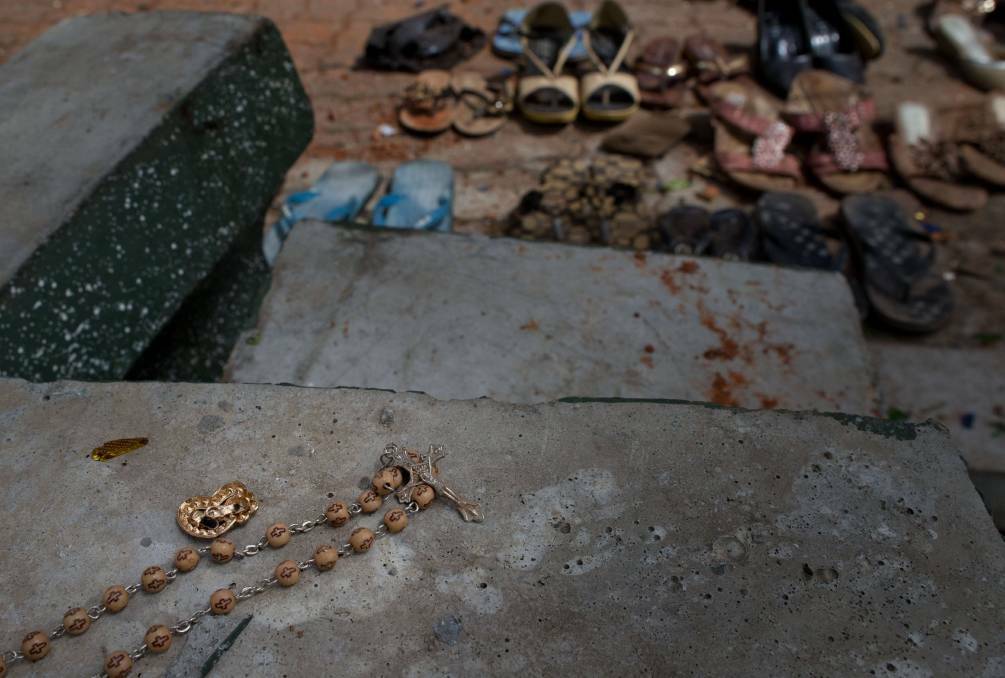 Footwear and personal belongs of victims kept close to the scene of a suicide bombing at St. Sebastian Church in Negombo, Sri Lanka. Photo: AP