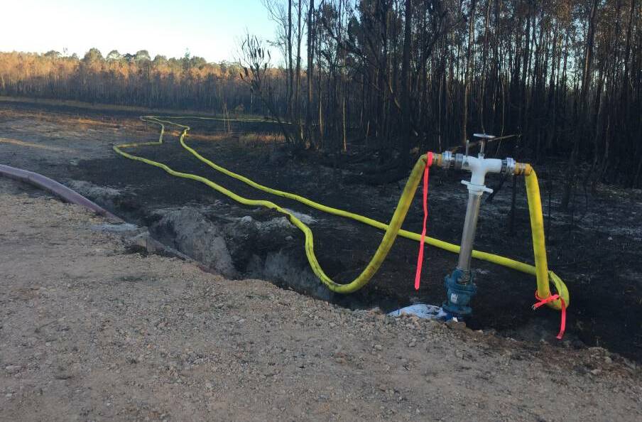 FLOODING: Reclaimed water piping leading to the Lindfield Park Road fire. Photo: Peter Daniels.