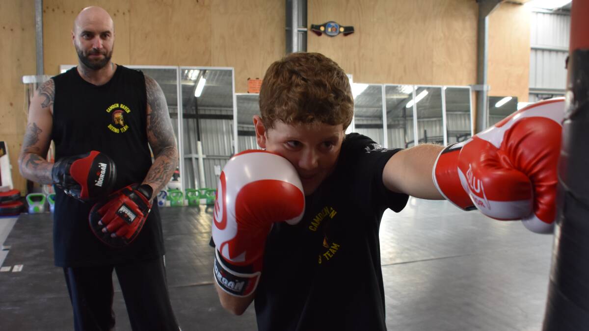 Young boxer training hard for double debut fights
