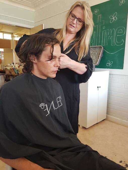 SNIPING INTO STYLE: Ben Morris getting a haircut at the Community Hair Project.