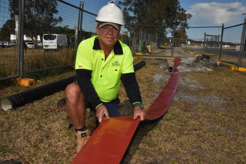 ON THE JOB: Plant operator Wayne Mulley installing pipeline near Port Macquarie Airport.