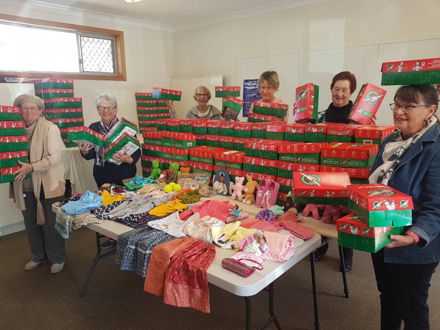 GENEROUS: Roslyn McKay, Carolyn Coker, Sue Kightley, Sandra English, Jeanette Peasley and Fran Herbert packing shoeboxes at Port Anglican Church.