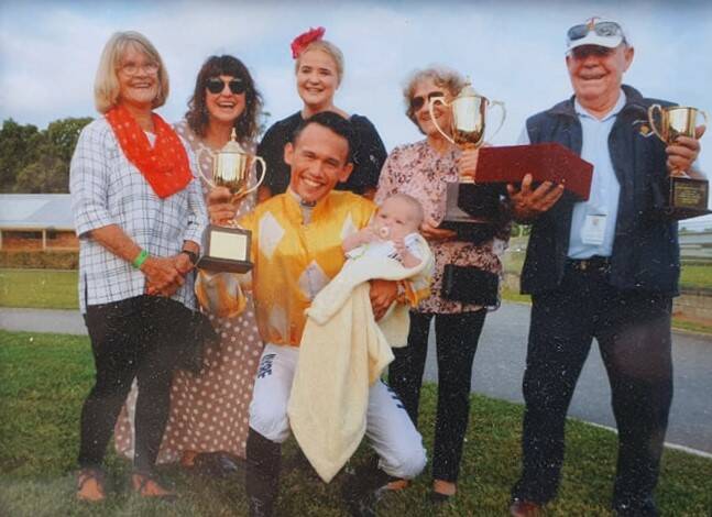 CELEBRATION IN COFFS: Owners including Jan Tate celebrate Glitra winning the Coffs Harbour Cup in 2018. Photo: Supplied/Jan Tate.