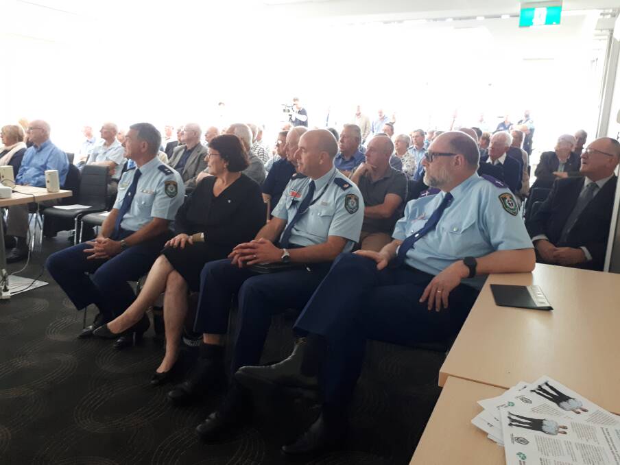 RECOGNISING THE RETIRED: Officers and families at the ceremony. Photo: NSW Police.