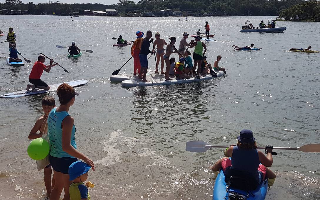 Competitors make a splash at Settlement Point for the Wayne Jackson Wellness Paddle
