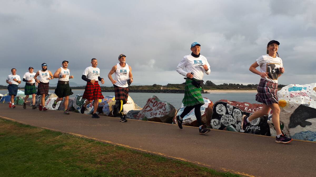POWER RUNNING: League of Kilted Athletes at the Port Macquarie breakwall. Photo: Clifford Hoeft.
