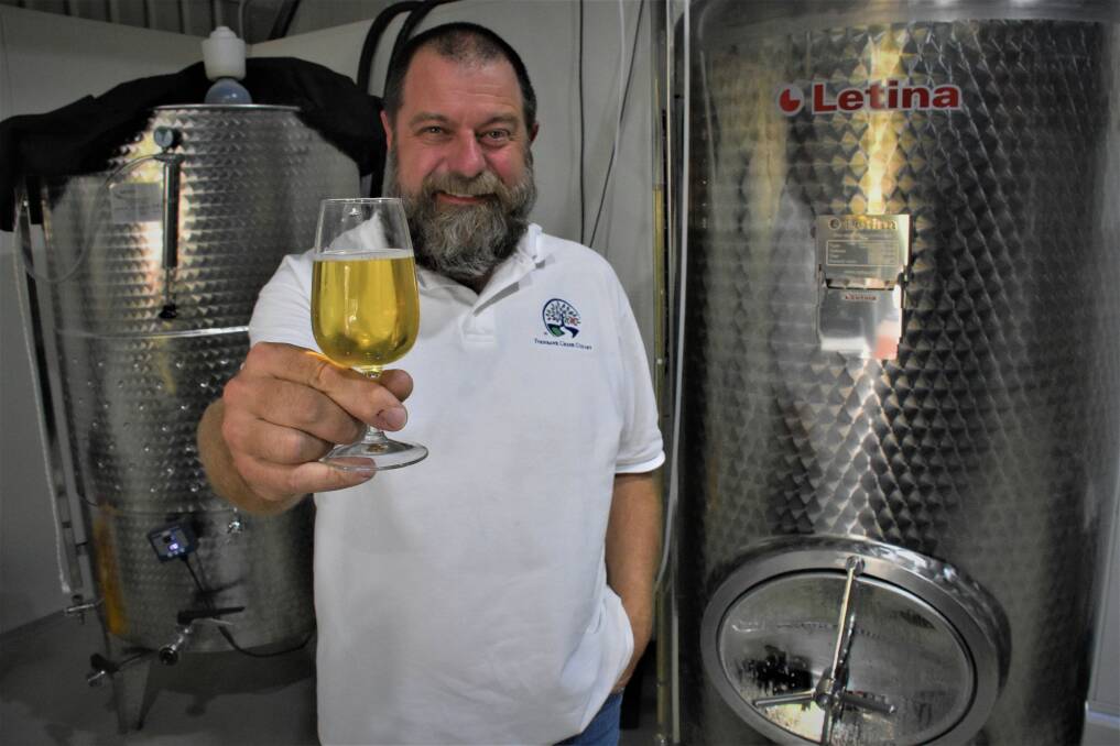 MASTER BREWER: Port Macquarie brewer Gary Cuttell with some delicious apple cider.