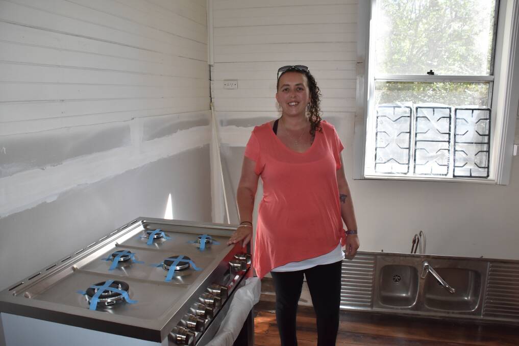 VOLUNTEER GUARDIANS: Amy Ward in her kitchen, which is still under construction.