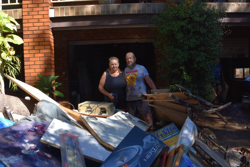 CLEANING UP: River Street residents Michelle and Glenn Kingston.