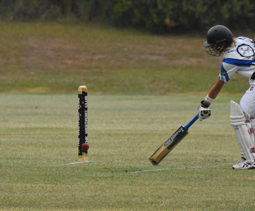 RUNNING BACK: Tom Marchant makes it safely back to the crease.