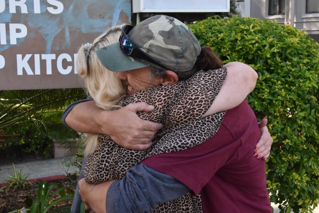 HELPING HAND: Lake Cathie resident Veneka 'Neikz' Jones hugged by Brigadoon Holiday Park resident Jamie Forsyth.